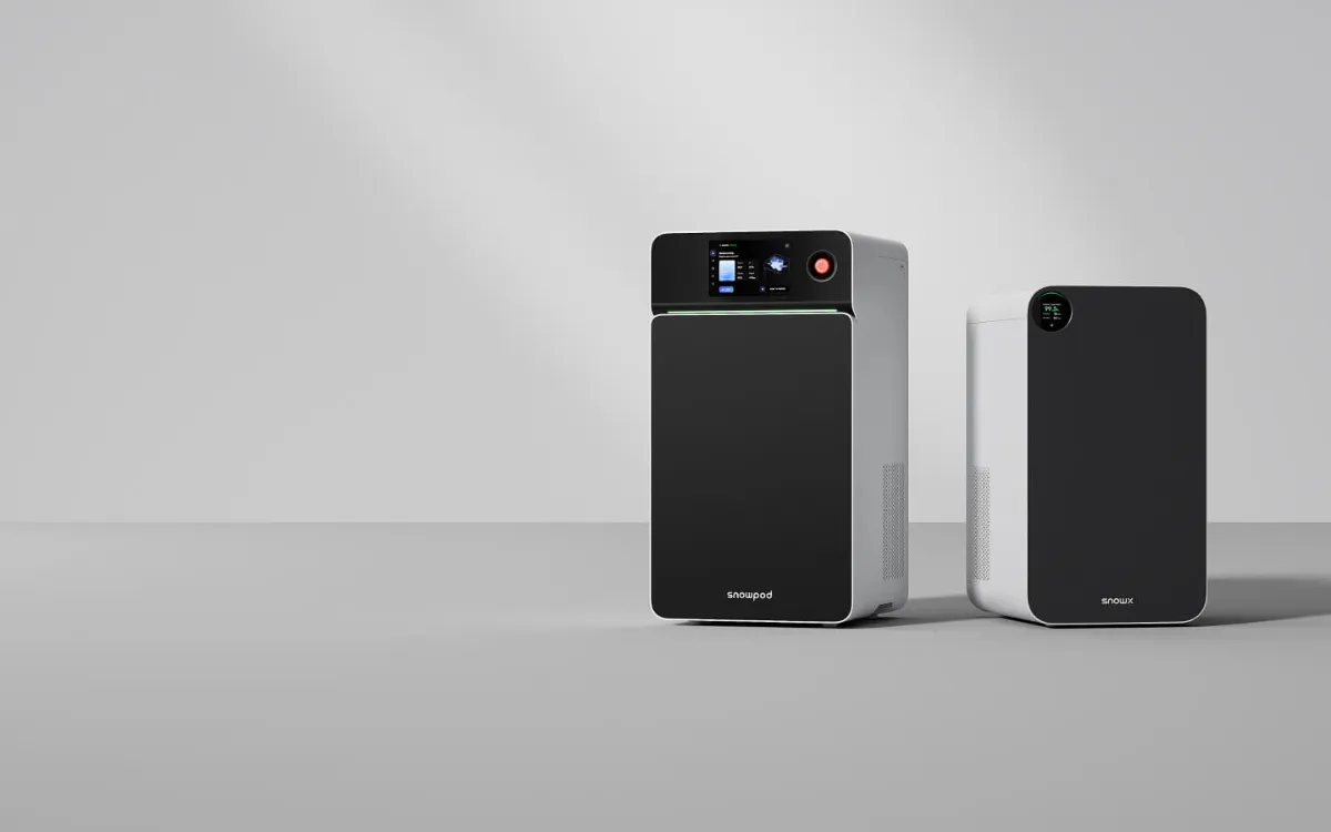 SnowX SnowPod desktop metal 3D printer next to its companion unit