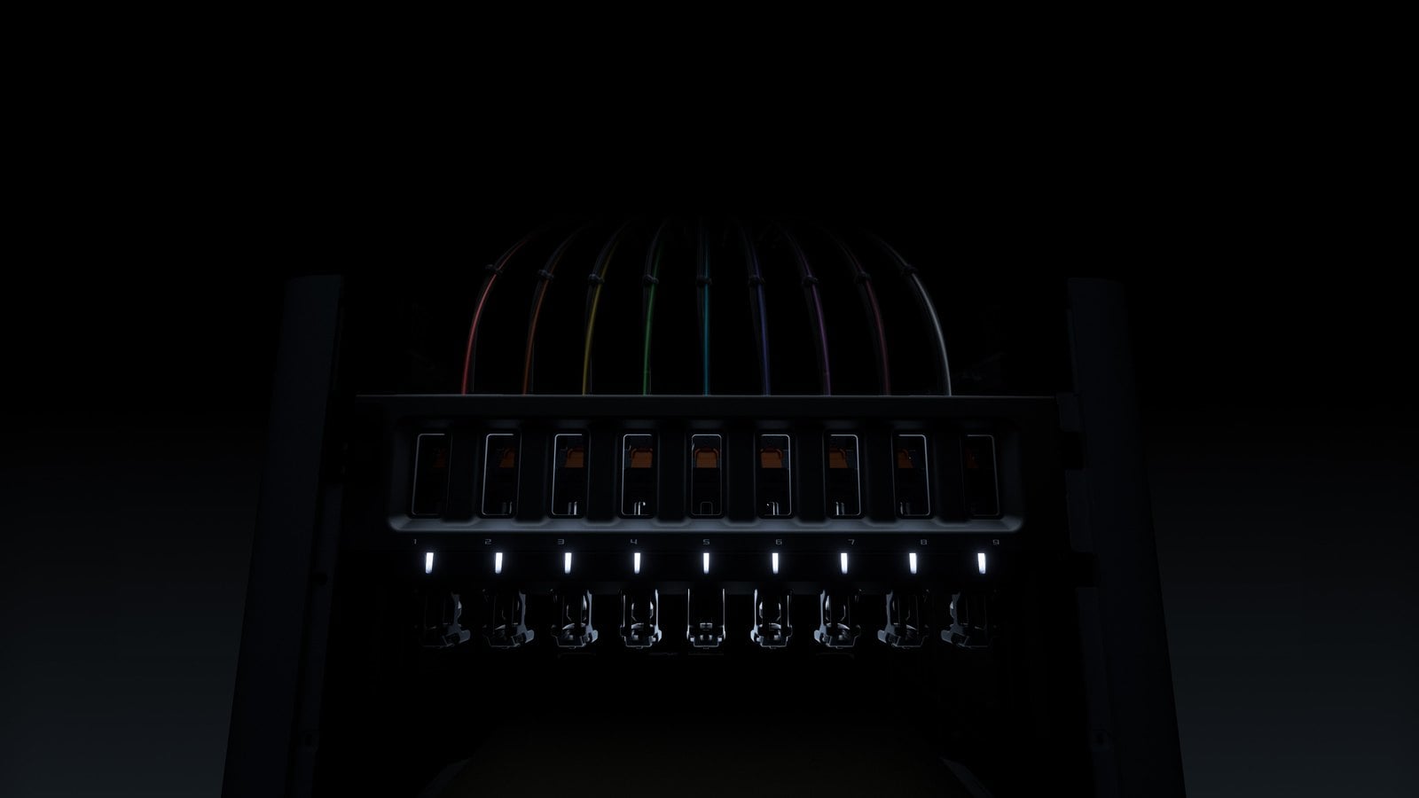 Bambu Lab H3C teaser: nine numbered tool docks with toolheads hanging below and nine filament tubes arching over the top