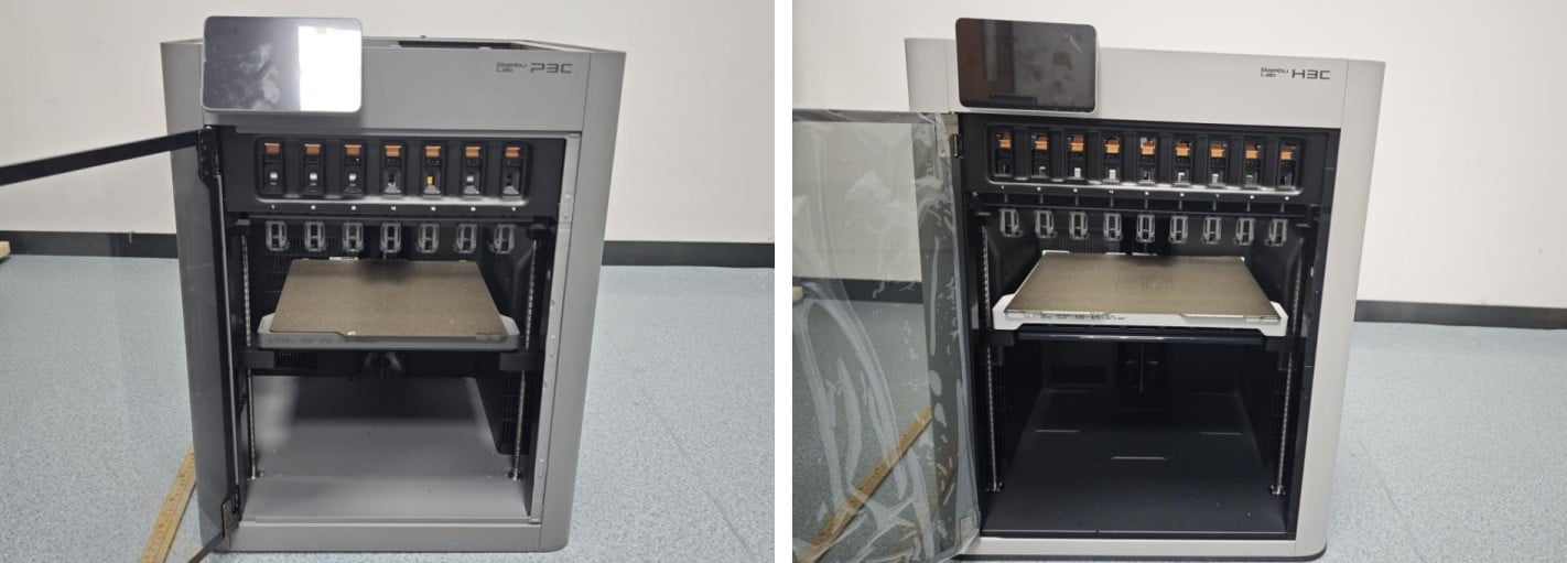 Two enclosed 3D printers side by side with their doors open: the gray Bambu Lab P3C with seven numbered tool docks, and the white Bambu Lab H3C with nine